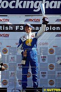 Nelson Piquet Jr celebrates winning race one at Rockingham