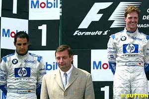 Montoya on the podium with Ralf, in France