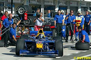 Winner Patrick Friesacher exits his pit bay after his compulsory pit stop