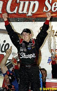 Kurt Busch celebrates victory as the crowd boos