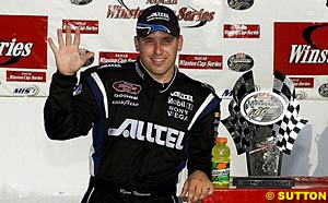 Ryan Newman raises his right hand, showing everyone it was his fifth win of the season