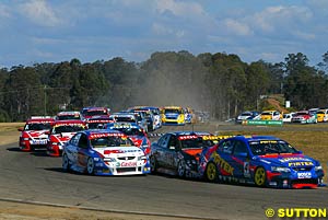 The start of the race, Marcos Ambrose with Paul Morris right on his rear bumper and Greg Murphy on Morris's outside