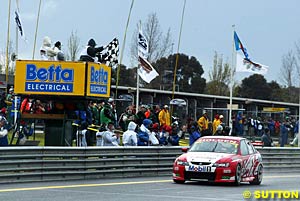 Mark Skaife takes the chequered flag to win the Sandown 500