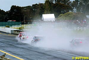 Spray enveloped cars as they battled through the rain