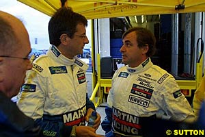 Luis Moya, left, with Carlos Sainz, right, in 2002