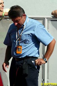 FIA scrutineer inspects tyres in Parc Ferme in Monza