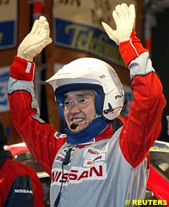 Kenjiro Shinozuka, before the start of the Dakar, wearing an open face helmet