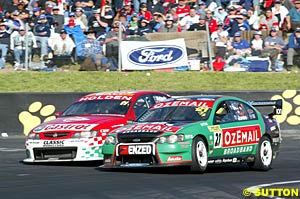 Brad Jones and John Bowe prevent Steven Richards and Larry Perkins from passing just before contact was made between the two cars