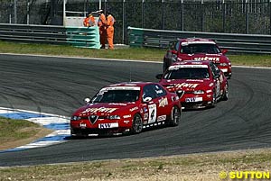 Gabriele Tarquini leads Autodelta teammates Roberto Colciago and Nicola Larini