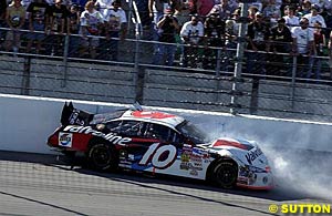 Johnny Benson hits the wall on the frontstretch