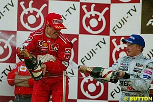 Schumacher and Raikkonen on the podium in Japan, 2002