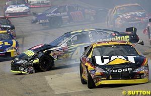 Jamie McMurray sits broadside after contact with the CAT Dodge of Ward Burton, as third place finisher Bobby Labonte also sits sideways in the background