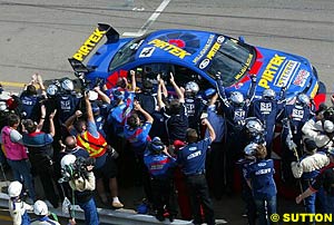 The Stone Brothers team cheer home Marcos Ambrose's win in race one