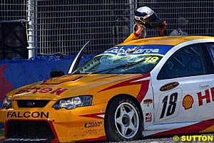 Max Wilson gets out of his car after debris shattered his windscreen