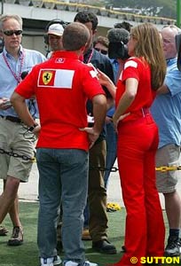 Rubens Barrichello with his press officer by his side