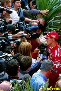 Schumacher surrounded by the media