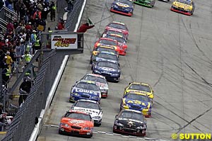 Fourth place finisher Tony Stewart leads the field at a restart