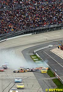 The lap one crash triggered by Casey Mears hitting the turn four wall