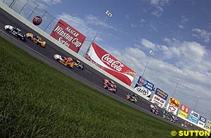 The cars pound around the high-banked turns early in the event