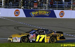 Matt Kenseth celebrates winning the title with a grassy donut