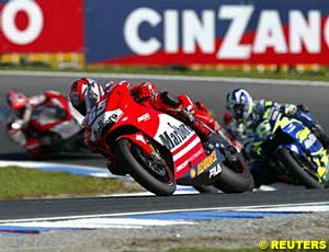 Second place finisher Loris Capirossi leads Sete Gibernau