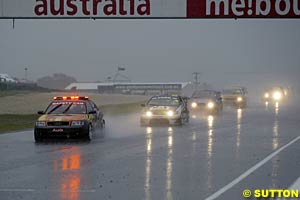 The cars trail around behind the Audi safety car just before the race was red flagged