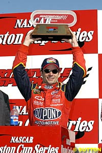 Winner Jeff Gordon holds his trophy up at Martinsville