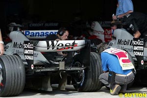 Scrutineers check cars in parc ferme