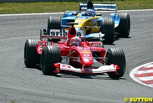 Alonso puts pressure on Barrichello