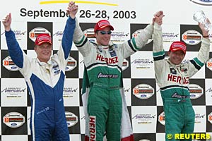 Third place finisher Mika Salo, winner Mario Dominguez and second place finisher Roberto Moreno celebrate on the podium