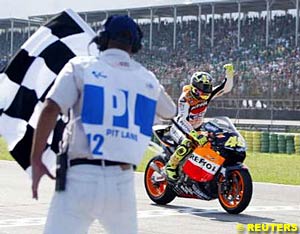 Valentino Rossi crosses the finish line to take the win