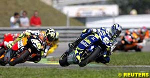 Sete Gibernau leads Valentino Rossi early in the race