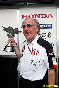 Richards with the 3rd place trophy in Malaysia