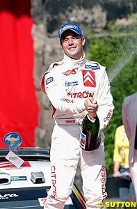 Rallye Deutschland winner Sebastien Loeb sprays the champagne