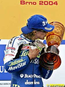 Winner Sete Gibernau kisses the winner's trophy