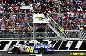 Jimmie Johnson takes the chequered flag to take the win on a day of loss for the Hendrick team