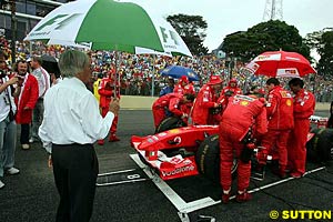 Bernie Ecclestone watches Ferrari prepare for the Grand Prix of Brazil