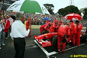 Bernie Ecclestone watches Ferrari prepare for the Grand Prix of Brazil