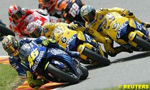 Valentino Rossi leads teammates Makoto Tamada and Max Biaggi before the rain