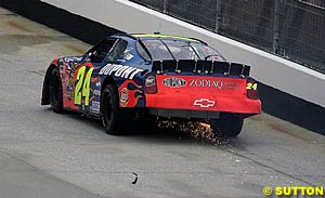 Jeff Gordon limps his wounded car back to the pits