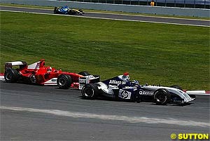 Montoya leads Schumacher into the first corner