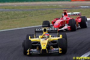 Michael Schumacher chases Timo Glock