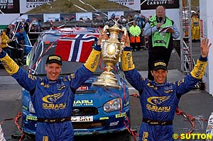 Phil Mills and Petter Solberg celebrate their last-gasp victory