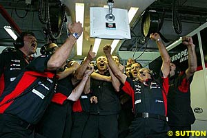 Minardi celebrate Jos Verstappen taking Provisional Pole in Friday Qualifying of the 2003 French Grand Prix