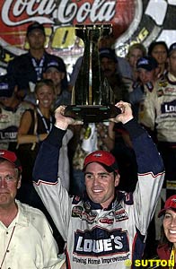 Jimmie Johnson with his winner's trophy