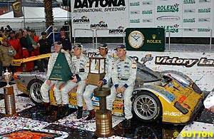 The winning crew of Forest Barber, Terry Borcheller, Christian Fittipaldi and Andy Pilgrim sit on their Doran Pontiac