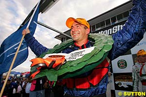 Marcos Ambrose celebrating his win, before the bad news