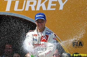 Winner Sebastien Loeb celebrates with the champers