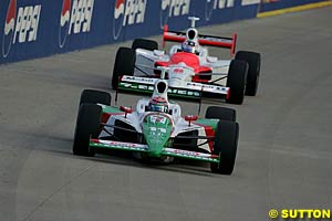 Winner Tony Kanaan leads second place finisher Sam Hornish