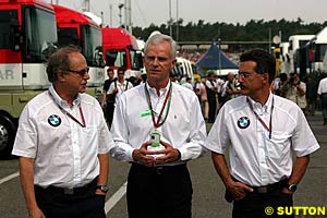 BMW's  Dr. Burkhard Goeschel, Dr. Helmut Panke, and Mario Thiessen 